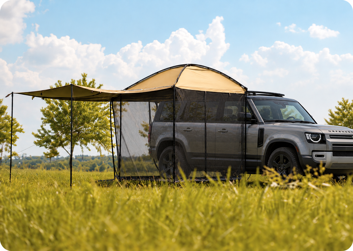 AT200 extended shade awning attached to the side roof edge of a gray Land Rover Defender
