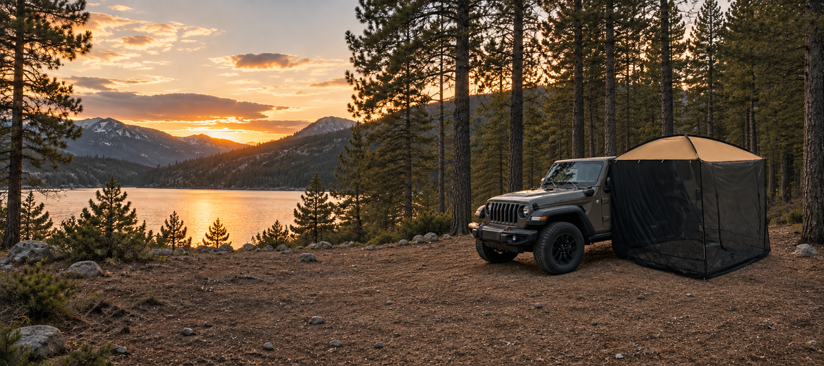 AT200 portable awning tent attached to a Jeep at a lakeside campsite at sunset, wide desktop banner