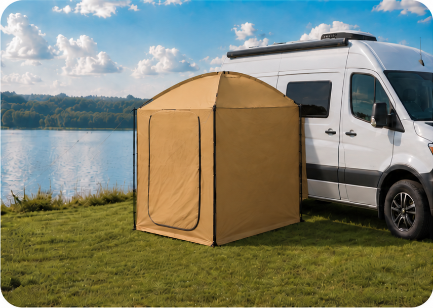 Tan privacy tent fitted closely against the side of a white camper van by a lake