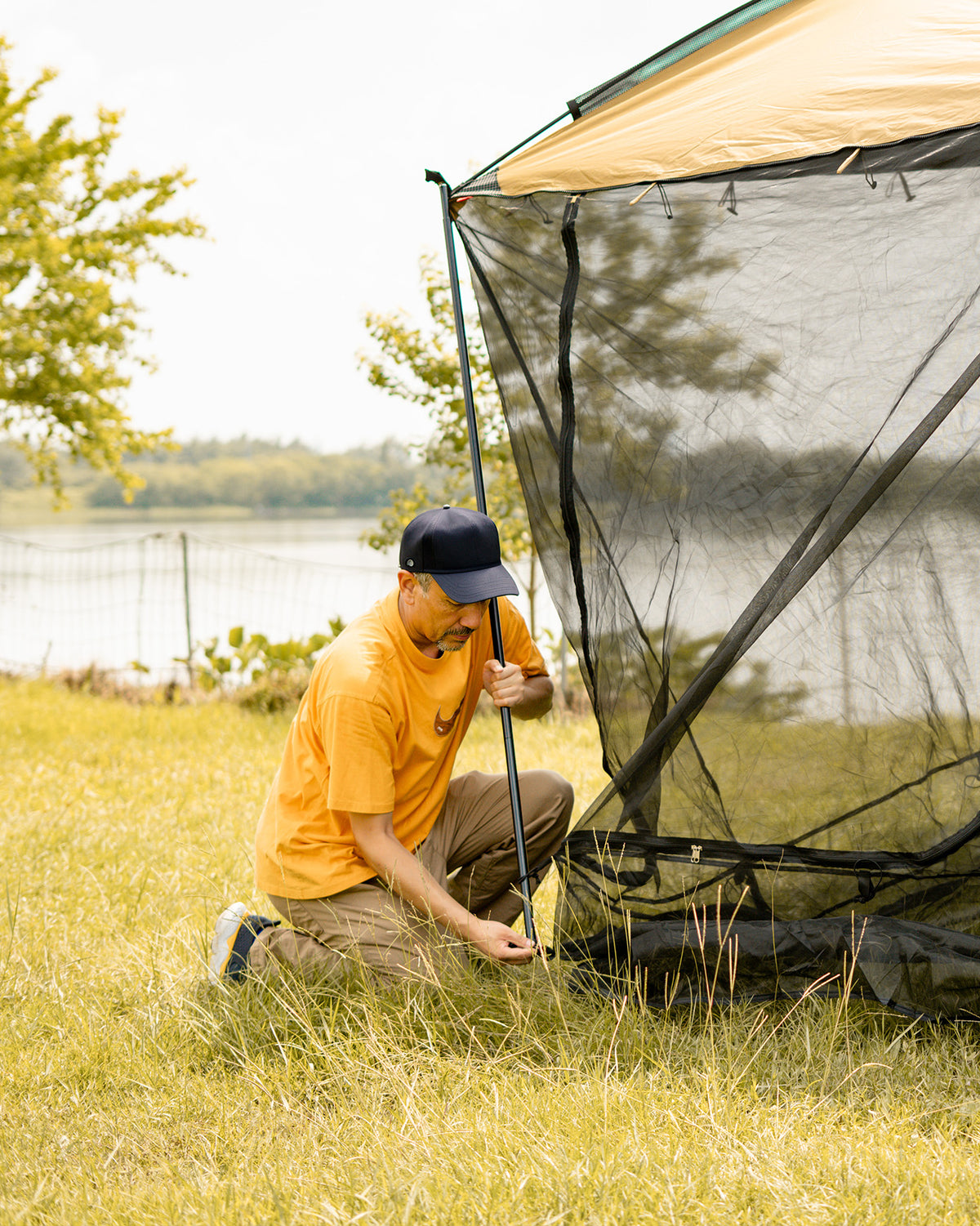 Installing the support poles on the AT200 awning tent